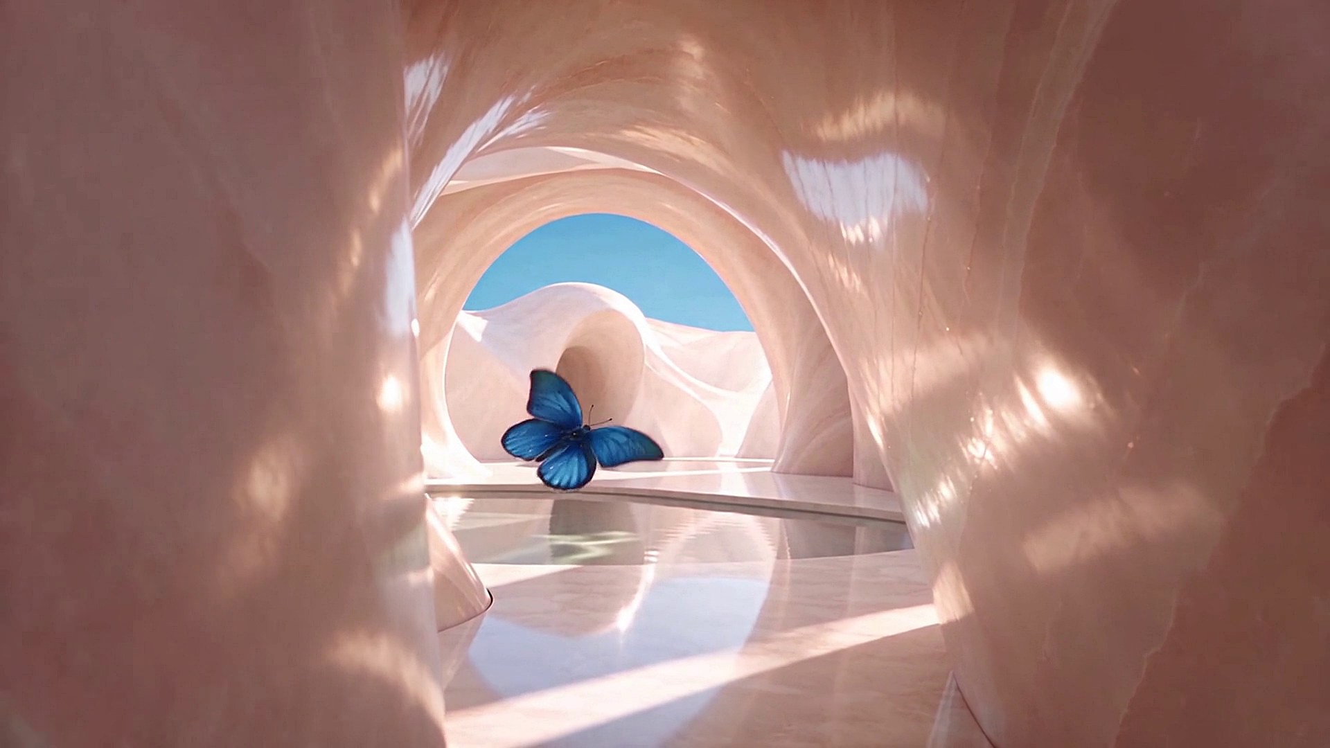 A vivid blue butterfly passes through softly lit blush marble arches and reflective water.